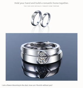 Detail showing two silver-plated couple rings forming a heart shape with small zircons
