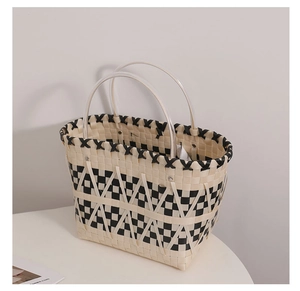 Close-up of woven checkered tote bag with double resin handles and branded interior label