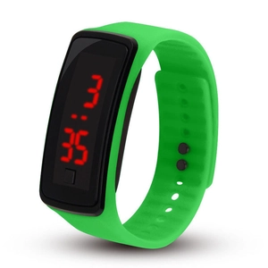 Detail view of green LED sports watch with red digital time display on black dial