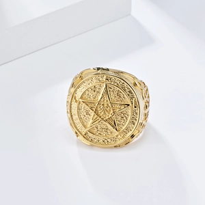 Detailed close-up of golden pentagram ring with vintage matte embossed finish