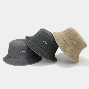 Three embroidered mountain bucket hats in grey, olive, and khaki for outdoor hiking