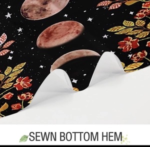 Detailed close-up showing the high-quality sewn bottom hem on sun and moon shower curtain