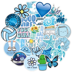 Detail showing blue VSCO vinyl stickers for luggage with wave and turtle patterns