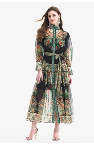 Detail of vintage paisley print dress with lantern sleeves and belted waist in black
