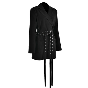 Detail of black blazer jacket featuring multiple decorative belts with metal buckles