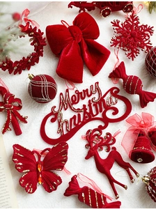 Detailed close-up of red flocked Christmas ornaments with snowflakes and velvet texture
