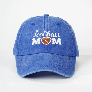 Detail of football MOM embroidery on a vintage washed blue denim baseball cap