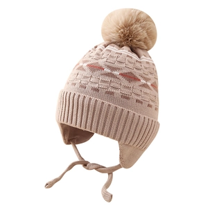 Winter knit hat for boys with jacquard diamond pattern and fluffy pompom in beige