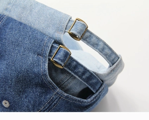 Close-up of denim baseball caps showing fabric texture and adjustable metal buckle