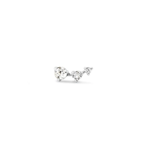 Macro shot of silver stud earring with three gradient cubic zirconia stones in row