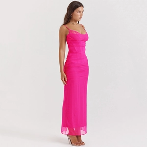 Detail view of pink bodycon dress with lace mesh and side slit in studio setting