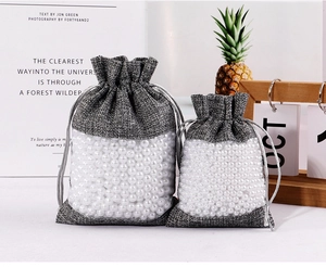 Linen drawstring bags with clear PVC window in two sizes showing pearl fillings