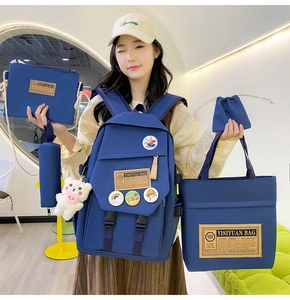 Detailed set of 5 navy blue nylon school bags including backpack and tote for students