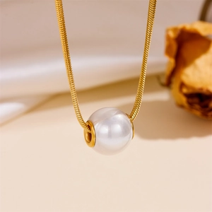 Elegant double layered gold snake chain necklace with a large round white pearl pendant