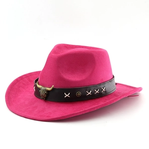 Detail of rose red felt cowboy hat featuring black leather band and bull head ornament