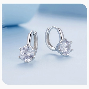Detail view of S925 sterling silver hoop earrings with 6-prong set sparkling zircon stones