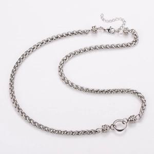 Detail of silver woven chain necklace in stainless steel with adjustable extender link