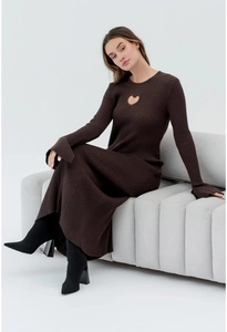 Detail of heart-shaped cutout design on a dark brown long-sleeve knit maxi dress