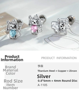 Detailed macro view of cat chef stud earrings with colorful heart-shaped zircon stones