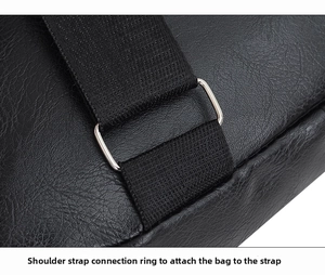 Close-up of the metal D-ring connecting the woven strap to the black textured leather bag