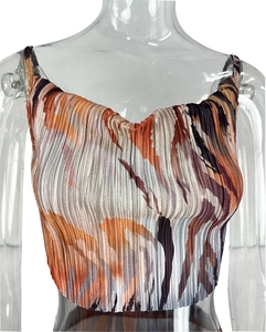Detail of pleated crop top featuring colorful abstract print and slim shoulder straps