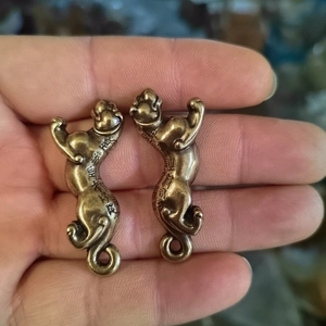 Pair of antique bronze tiger seals with embossed Chinese characters for good fortune