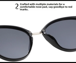 Detail of ergonomic nose pads and silver metal bridge on black cat-eye sunglasses