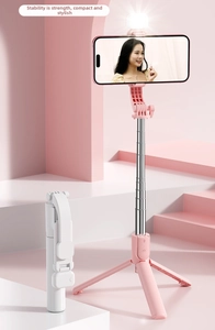 Macro detail of foldable selfie stick tripod with LED fill light and stainless steel rod