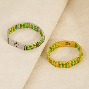 Close-up of double-layer beaded bracelets in gold and silver finish with toggle clasp