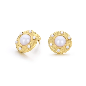 Textured gold flower earrings with large central pearl and small outer pearl accents