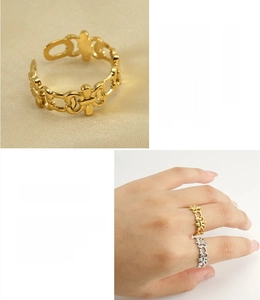 Detail view of hollow clover design ring in 18k gold plating on stainless steel