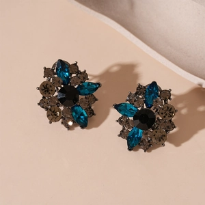 Vintage floral crystal stud earrings with blue petals and silver needle backings