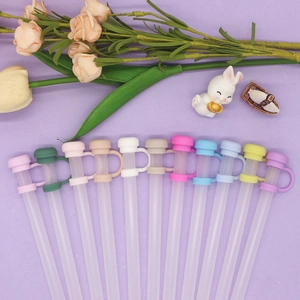 Close-up of colorful silicone 10mm straw toppers in various pastel shades and textures