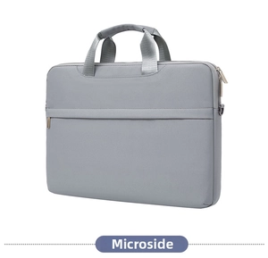 Front pocket detail of gray 14-inch laptop bag showing zippers and reinforced handles