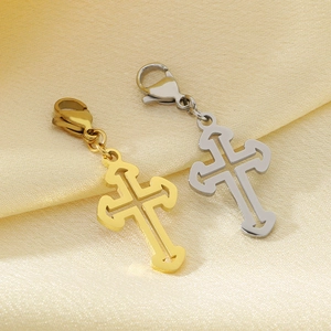 Detailed view of hollow gothic cross pendants in gold and silver steel finishes