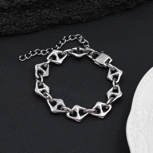 Detail view of silver titanium steel anchor link bracelet with lobster clasp and chain