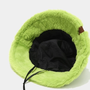 Neon green plush bucket hat with warm faux fur texture and black inner lining adjustment