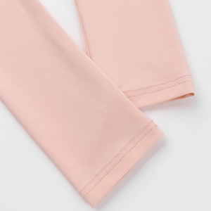 Detail of pink square neck top showing high-elasticity fabric and double-needle stitching