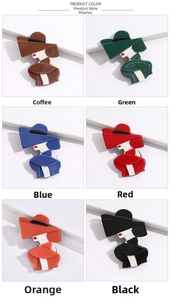 Macro display of acrylic fashion lady brooches in six vibrant colors on white steps
