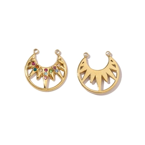 Detail of gold celestial crescent moon pendants with sunburst and rhinestone inlay