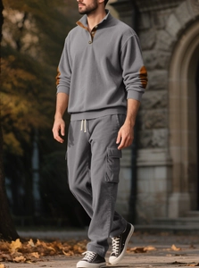 Men's grey corduroy set with high neck pullover and cargo pants in an outdoor setting
