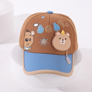 Detail of embroidered cartoon bear and baby text on kids colorblock baseball cap