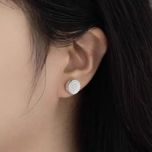 Moissanite 925 sterling silver stud earrings with round pave diamonds on model