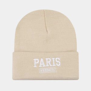 Detailed view of Paris French letter embroidery on beige knitted beanie hat cuff