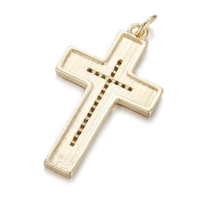 Detailed view of golden cross pendant with micro-pave texture and brushed metal finish