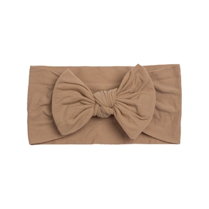 Soft brown nylon bow headband for infants with elastic fabric for comfortable wear