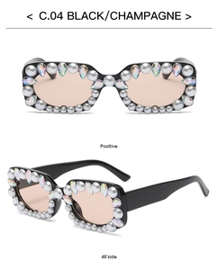 Detail view of black square sunglasses with pearl and colorful rhinestone embellishments