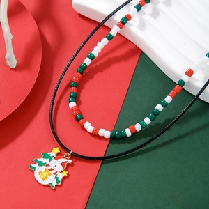 Detail of Christmas beaded necklace featuring Santa Claus pendant and festive glass beads