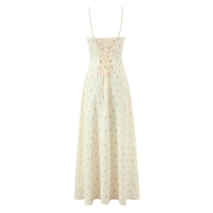 Detail view of the back lace-up design on this floral beige spaghetti strap dress