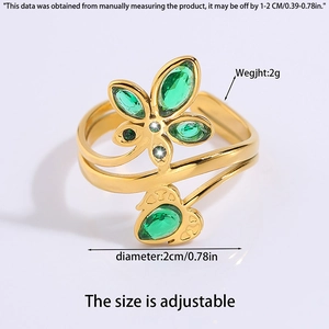Detail showing adjustable gold ring with butterfly wheat motif and green gemstone